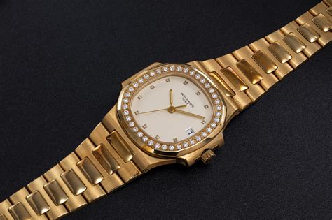 patek philippe yellow gold nautilus with baguette diamond bezel|Patek Philippe 3800 watch.